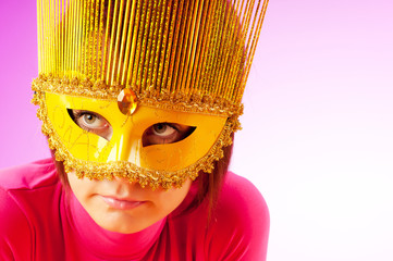 Attractive woman posing in the stylish mask