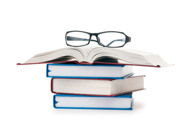 Reading glasses with books isolated on the white