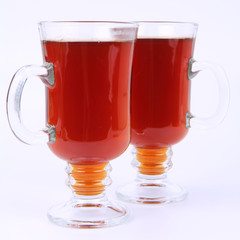 Two glasses of tea on white background