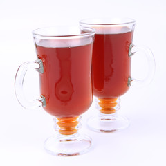 Two glasses of tea on white background