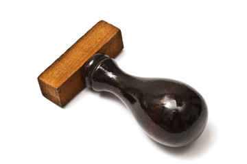 Old wooden rubber stamper isolated on white