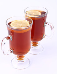 Two glasses of tea with lemon