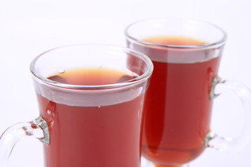 Two glasses of tea on white background