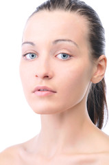 Fototapeta premium portrait of a young beautiful woman looking at camera, isolated