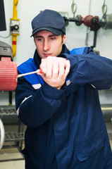 heating engineer in boiler room