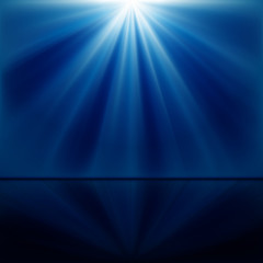 background of blue luminous rays with reflection