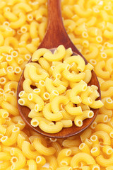 background of pasta and a wooden spoon