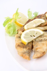 Fried fish decorated with lemon