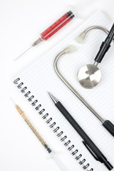 Notebook and stethoscope