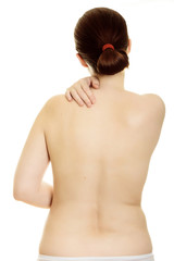 Naklejka premium Woman massaging pain back isolated over a white background.