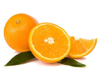 oranges and green leaves isolated on white