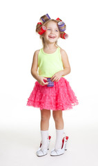 Little girl play fashion in mothers shoes and rollers