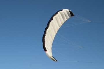 a parafoil paragliding on air with blue sky background