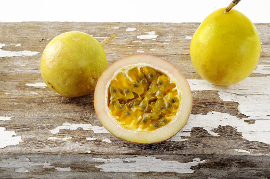 green passionfruit on wood background
