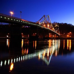 Fototapeta na wymiar Foot bridge cross the Dniper river, Kiev, Ukraine