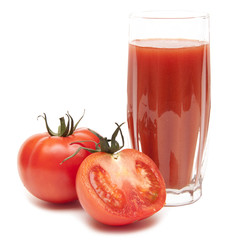 Fresh tomatoes and a glass full of tomato juice
