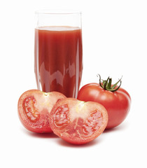 Fresh tomatoes and a glass full of tomato juice