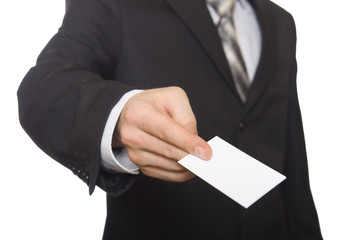 Businessman handing a blank business card over white