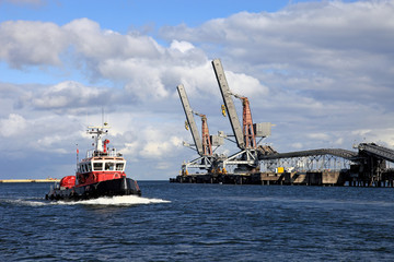 A red fireboat return to port. Gdansk, Poland.