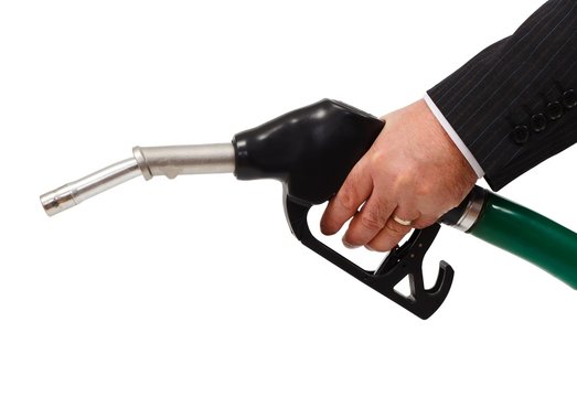 Hand holding gas nozzle