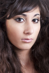 Fototapeta premium Portrait of beautiful young fashion model with gold makeup