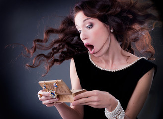 beautiful young brunette woman with a casket