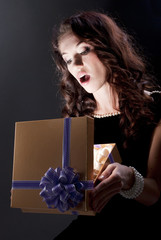 beautiful young brunette woman with a present