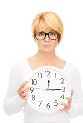 woman holding big clock