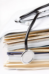 stethoscope on the stack of paper