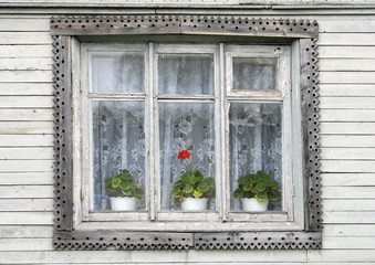 Old window in wooden house