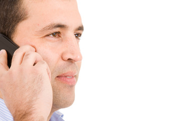 Fototapeta premium Close-up portrait of a young casual man on the phone. Isolated o