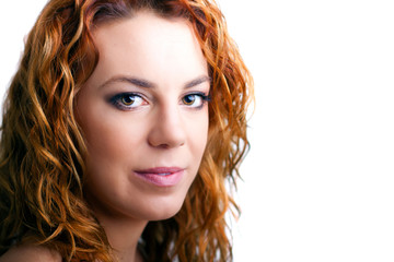 Naklejka premium portrait of a beautiful happy young girl with red hair
