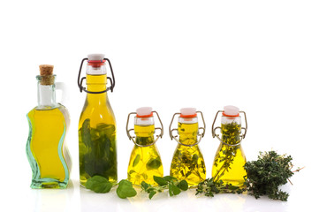 Bottles olive oil with herbs