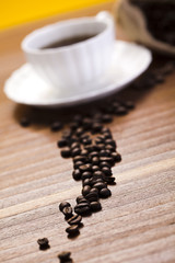 Cup with beans coffee