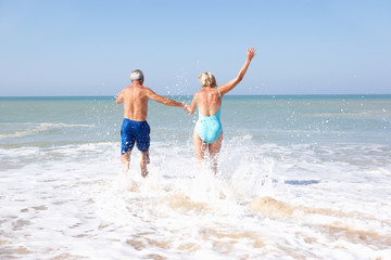 Senior couple on beach holiday