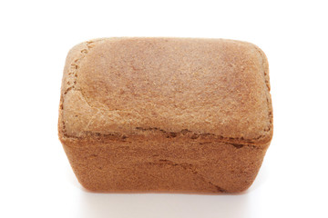 The loaf of bread is isolated on a white background