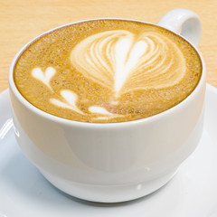 heart symbol on latte coffee cup
