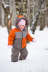 Fototapeta na wymiar cute baby walk in winter park