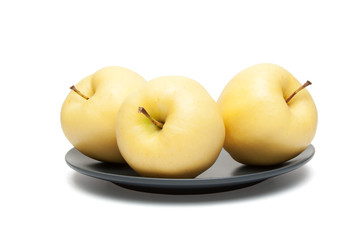 yellow apples on plate
