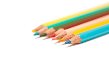 Many colored pencils isolated on white