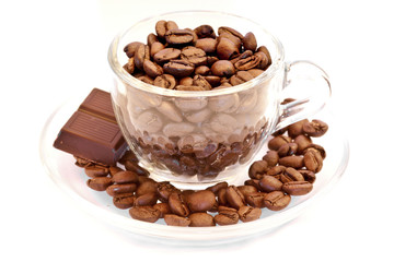Cup filled with coffee beans and chocolate bar