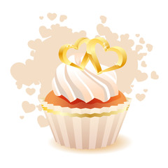 Sponge cake with two gold hearts isolated