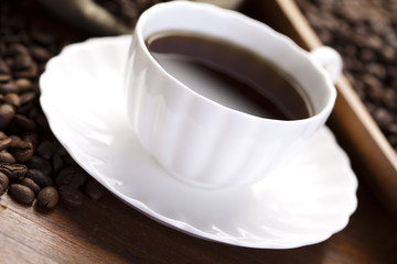 Cup with beans coffee
