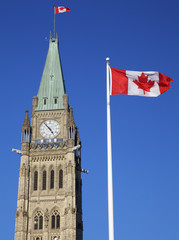 Fototapeta na wymiar Canadian Flag and Peace Tower, Parliament, Ottawa, Canada