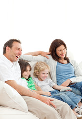 Obraz premium Happy family watching a movie together