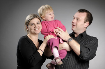 white family posing in studio