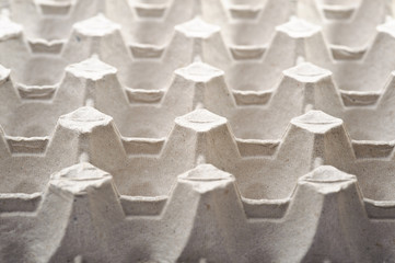 Fototapeta premium Empty cardboard egg holder, abstract stucture background