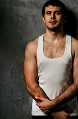 Man with an athletic body, studio portrait