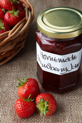 A still life of strawberry jam
