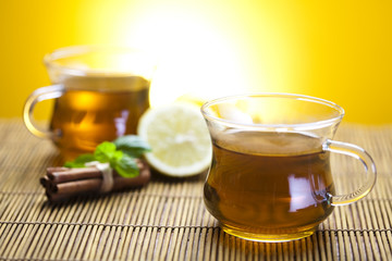 Glass cup of tea with lemon